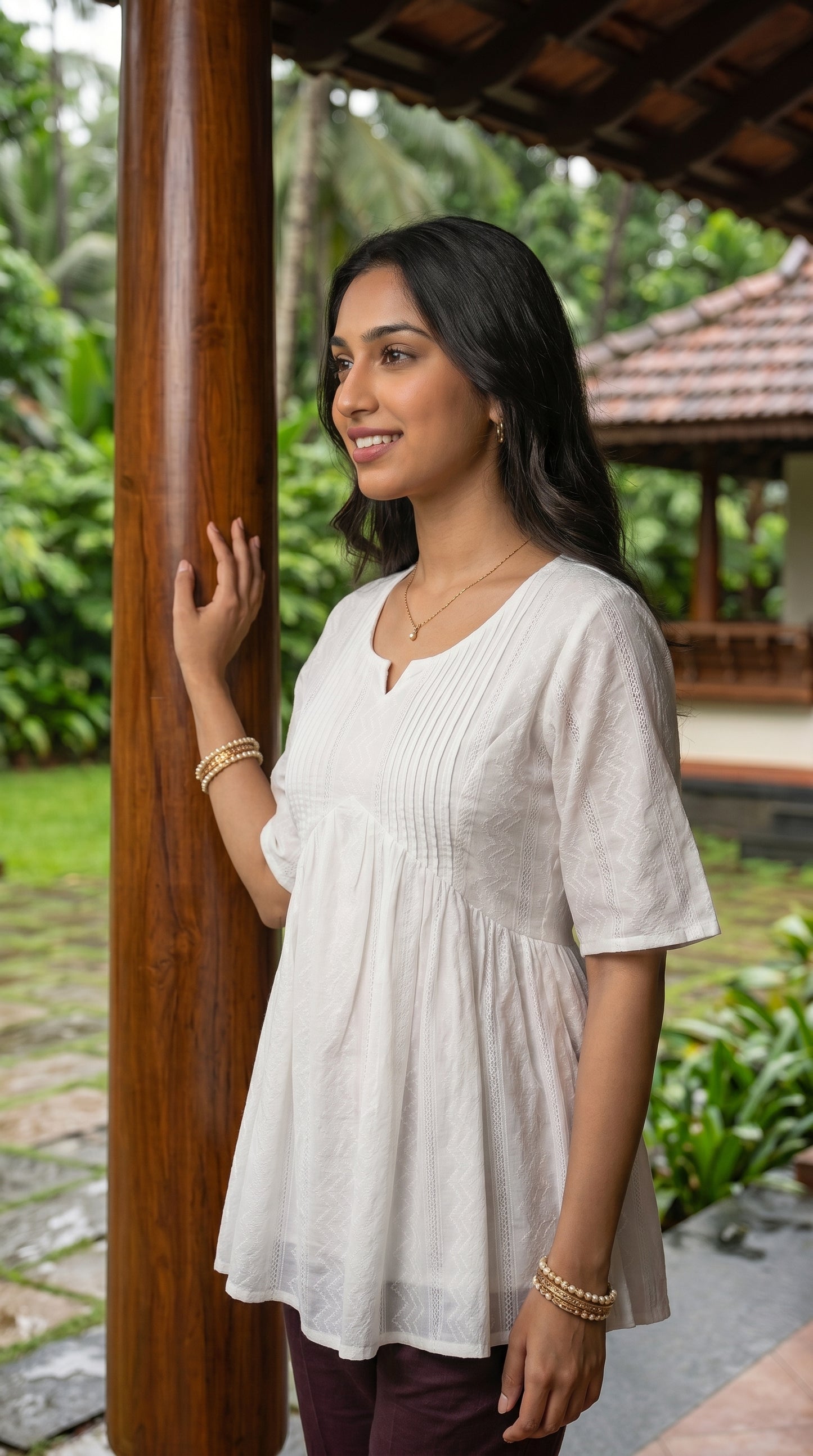 The Ivory Pintuck Peplum Top